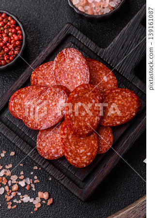 Sliced smoked pepperoni or salami as a pizza topping. Pepperoni sausage 139161087