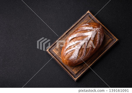 A loaf of homemade whole grain rye bread for the dinner table. A loaf of rye bread 139161091
