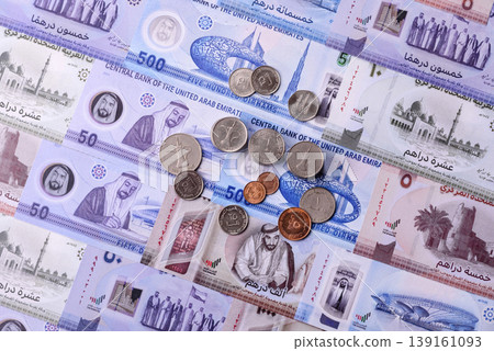 United Arab Emirates cash, dirhams and coins for exchange and financial transactions. UAE currency United Arab Emirates cash, dirhams and coins for exchange and financial transactions. UAE currency 139161093