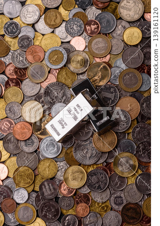 A silver bar, white metal against a backdrop of money, as a concept for the sales. A silver bar A silver bar, white metal against a backdrop of money, as a concept for the sales. A silver bar 139161120