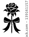 A beautiful arrangement of black roses elegantly tied with a ribbon, creating a striking and sophisticated visual. 139161157