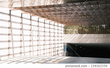 The geometric interplay of light and shadow created by the lattice roof: the exterior design of modern architecture. The geometric interplay of light and shadow created by the lattice roof: the exterior design of modern architecture. 139161554