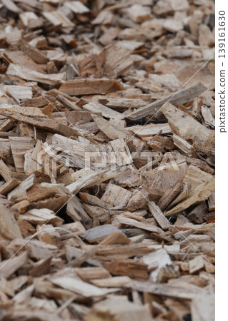 Rustic Wood Chips Texture: Natural Light Brown Background for Garden, Landscape, or Biofuel Concepts Rustic Wood Chips Texture: Natural Light Brown Background for Garden, Landscape, or Biofuel Concepts 139161630