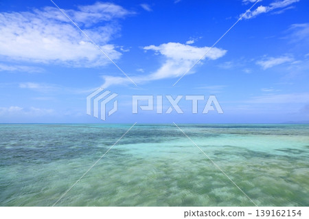 The sea at Taketomi Island's West Pier boasts a beautiful emerald green gradient. The sea at Taketomi Island's West Pier boasts a beautiful emerald green gradient. 139162154