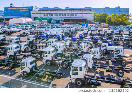 Yokohama cityscape, Japan; Japanese economy...view of trucks lined up at Daikoku Pier. 139162302