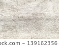 Close-up of Light-colored textured concrete wall with rough surface and subtle color variations 139162356