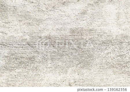 Close-up of Light-colored textured concrete wall with rough surface and subtle color variations 139162356