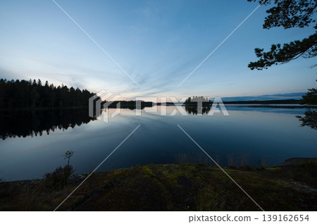 Autumn night scenery on the shore of a lake in Finland 139162654
