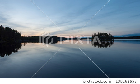Evening scenery by a lake in Finland Evening scenery by a lake in Finland 139162655