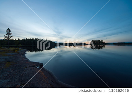 Autumn evening scenery on the rocky shore of a lake in Finland Autumn evening scenery on the rocky shore of a lake in Finland 139162656