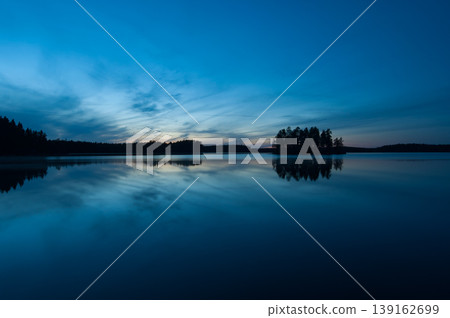 Autumn night scenery in the forests by a lake in Finland Autumn night scenery in the forests by a lake in Finland 139162699