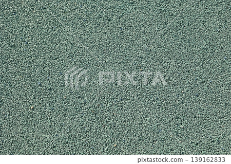 Background material featuring green gravel. Granular texture. Copy space available. 139162833