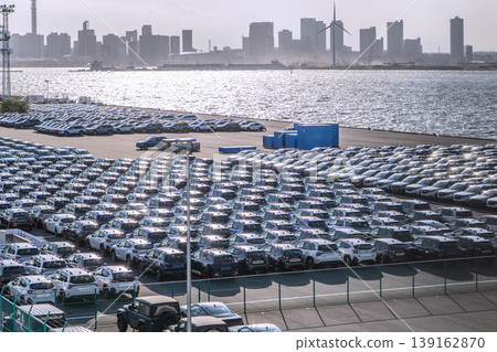 Yokohama cityscape, Japan; Japanese economy...view of cars lined up at Daikoku Pier. Yokohama cityscape, Japan; Japanese economy...view of cars lined up at Daikoku Pier. 139162870
