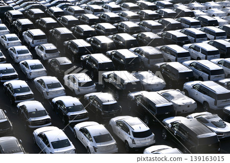 The urban landscape of Yokohama, Japan; the US-Japan global economy…view of cars lined up at Daikoku Pier. The Age of Wisdom The urban landscape of Yokohama, Japan; the US-Japan global economy…view of cars lined up at Daikoku Pier. The Age of Wisdom 139163015