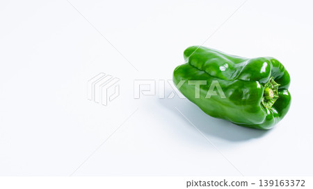 One bell pepper (vegetable ingredient) - fresh green vegetable against a white background One bell pepper (vegetable ingredient) - fresh green vegetable against a white background 139163372