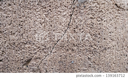 Cracked and Dull Concrete Wall Texture with Rough Details 139163712