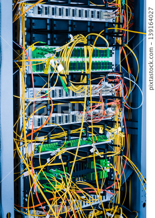 detail of server rack with fiber optic cables attached to front detail of server rack with fiber optic cables attached to front 139164027