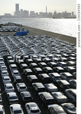 The urban landscape of Yokohama, Japan; the US-Japan global economy…a view of cars lined up at Daikoku Pier. An era of hope. The urban landscape of Yokohama, Japan; the US-Japan global economy…a view of cars lined up at Daikoku Pier. An era of hope. 139164565