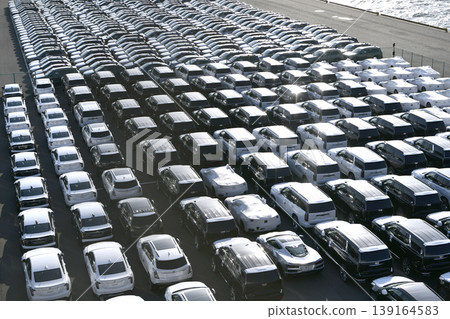 The urban landscape of Yokohama, Japan: A blend of Japanese and American wisdom and the global economy… Views of cars lined up at Daikoku Pier. Towards tomorrow. The urban landscape of Yokohama, Japan: A blend of Japanese and American wisdom and the global economy… Views of cars lined up at Daikoku Pier. Towards tomorrow. 139164583
