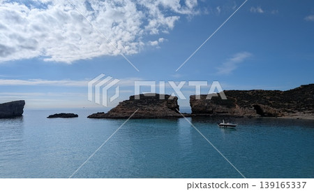 Seascape with rocky shores and a boat on the Mediterranean sea Seascape with rocky shores and a boat on the Mediterranean sea 139165337