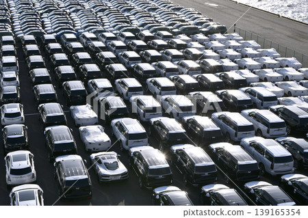 The urban landscape of Yokohama, Japan; the US-Japan global economy…view of cars lined up at Daikoku Pier. Cooperation, towards a new era. The urban landscape of Yokohama, Japan; the US-Japan global economy…view of cars lined up at Daikoku Pier. Cooperation, towards a new era. 139165354