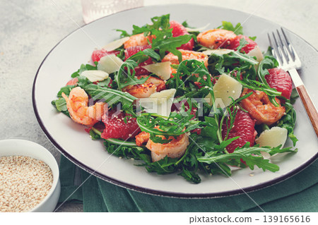 Fresh shrimp salad with arugula, grapefruit, and parmesan served in a bowl 139165616