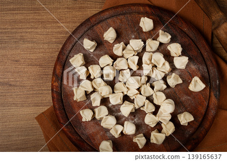 Traditional Turkish dumplings,raw, on a cutting board, top view, no people, 139165637