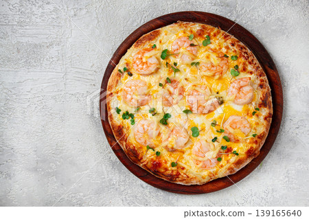 four cheese pizza with shrimp and fresh microgreens, served on a wooden board, homemade, no people, 139165640