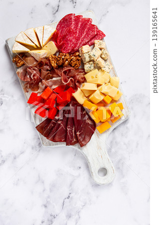 assortment of cheese meat cuts, on a plate, top view, no people, 139165641