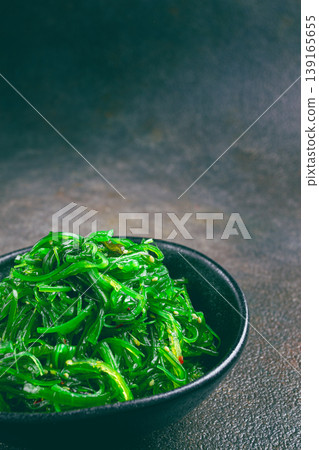 Chuka salad, made from fresh seaweed, with sesame dressing, served in a black bowl, Chuka salad, made from fresh seaweed, with sesame dressing, served in a black bowl, 139165655