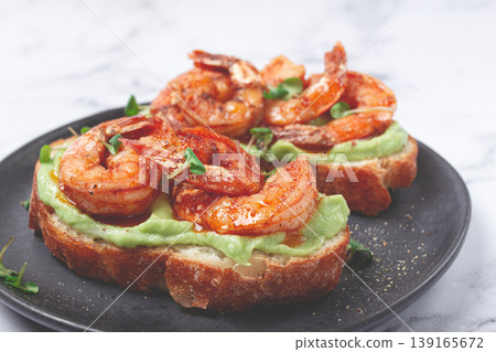 sandwiches with avocado and caramelized shrimp, micro-greens, breakfast, on a plate, top view, homemade, no people, sandwiches with avocado and caramelized shrimp, micro-greens, breakfast, on a plate, top view, homemade, no people, 139165672