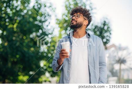 Handsome man is outdoors in the city Handsome man is outdoors in the city 139165828