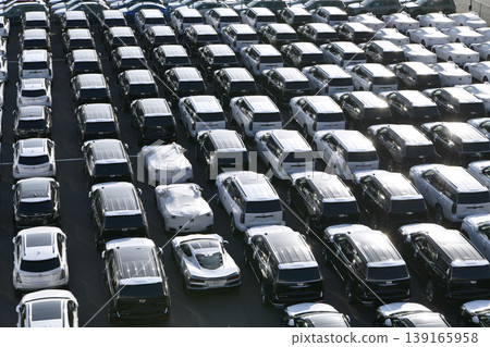 Yokohama, Japan: A glimpse into the global economy…passenger cars lined up at Daikoku Pier. Towards a new era. Yokohama, Japan: A glimpse into the global economy…passenger cars lined up at Daikoku Pier. Towards a new era. 139165958