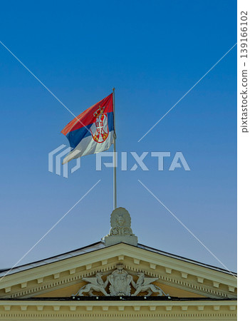 Serbian flag on blue sky Serbian flag on blue sky 139166102
