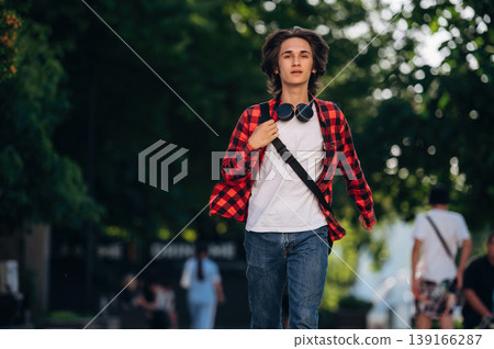 Young student is having a walk in the town Young student is having a walk in the town 139166287