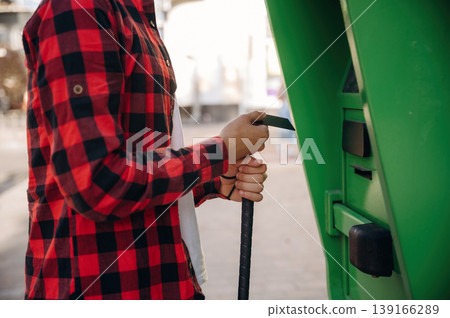 Close up view of man with white cane by the ATM using credit card Close up view of man with white cane by the ATM using credit card 139166289