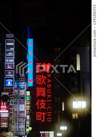 The vibrant neon signs and bustling cityscape that illuminate the night in Shinjuku Kabukicho, Tokyo. The vibrant neon signs and bustling cityscape that illuminate the night in Shinjuku Kabukicho, Tokyo. 139166355