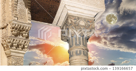 Arches in Islamic (Moorish) style (against the sunset with the super moon) in Alhambra, Granada, Spain 139166657
