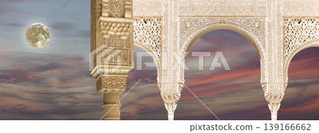 Arches in Islamic (Moorish) style (against the sunset with the super moon) in Alhambra, Granada, Spain Arches in Islamic (Moorish) style (against the sunset with the super moon) in Alhambra, Granada, Spain 139166662