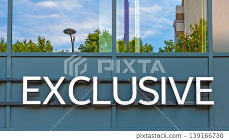 Exclusive sign on a building facade Exclusive sign on a building facade 139166780
