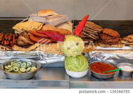 Market stall selling meat and other food Market stall selling meat and other food 139166785