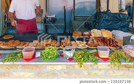 Selling barbecue on market stall Selling barbecue on market stall 139167136