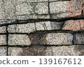Rough granite stone wall texture background 139167612