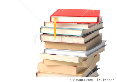 Stack of different books with book with yellow bookmark on its top isolated on a white background Stack of different books with book with yellow bookmark on its top isolated on a white background 139167727
