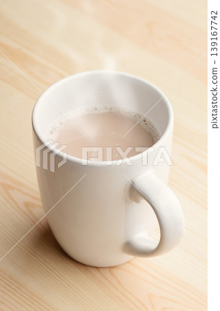 Cup of hot chocolate stands on wooden table Cup of hot chocolate stands on wooden table 139167742