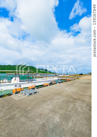 Summer scenery at Funakoshi Fishing Port in Ishigaki Island, where the emerald sea stretches out before you. Summer scenery at Funakoshi Fishing Port in Ishigaki Island, where the emerald sea stretches out before you. 139167849