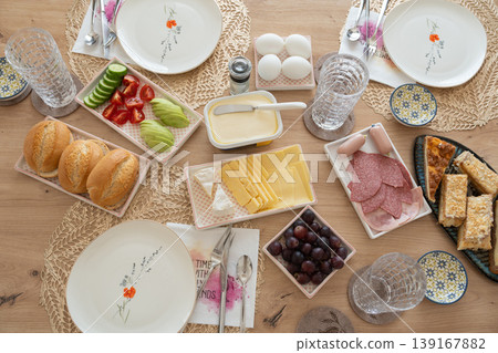 Top view of breakfast table with bread, cheese, fruits and coffee. Healthy meal concept. Morning meal with bread cheese fruits Top view of breakfast table with bread, cheese, fruits and coffee. Healthy meal concept. Morning meal with bread cheese fruits 139167882