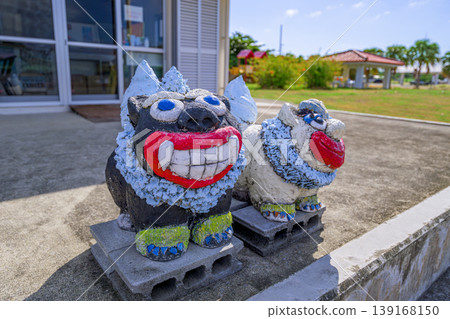 A charming Shisa statue welcomes you at a rest stop in Ishigaki Island. A charming Shisa statue welcomes you at a rest stop in Ishigaki Island. 139168150
