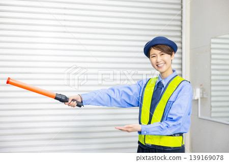 Security guard to guide traffic 139169078