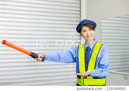 Security guard to guide traffic Security guard to guide traffic 139169082